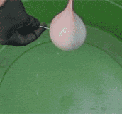 Mercury filled water balloon popped in slow motion…