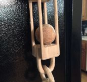 Carved this out of a solid block of wood. A caged ball and chain.