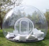 Inflatable lawn tent. Imagine laying in this thing in the rain.
