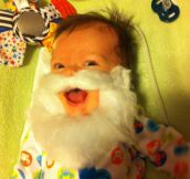 My 2 Month Old Son Really Likes Santa’s Beard