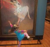 Little girl dances with painting