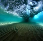 Underneath a breaking wave… and a fish