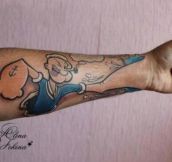 Clever tattoo, fist of Popeye…