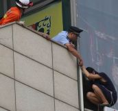 Beijing Cop Handcuffs Himself To Suicidal Woman On Ledge To Save Her Life