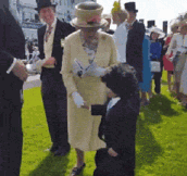 Little Guy Takes Off His Hat To Shake Hands With Queen