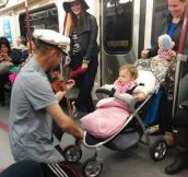 Man spent his subway ride playing his violin for a baby it was crying