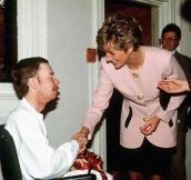 Princess Diana shakes hands with an AIDS patient without gloves, a profound gesture at the time, 1991