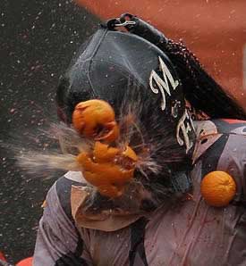 orange throwing1 The 10 Weird Festivals Where People Throw Things At Each Other