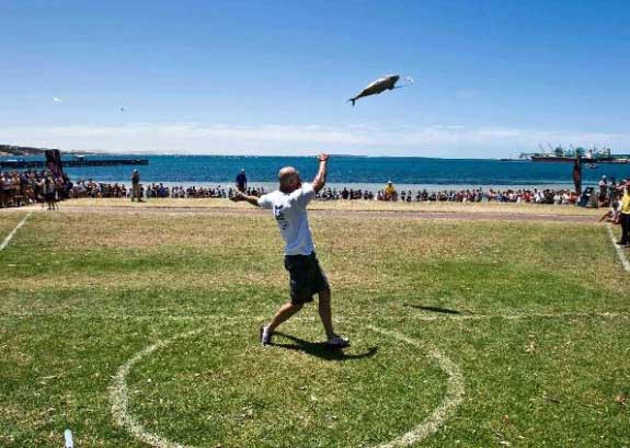 tuna throwing The 10 Weird Festivals Where People Throw Things At Each Other