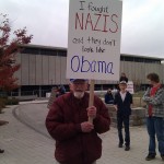 Old man with rally sign