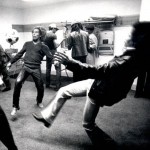 Bob Marley and Jimi Hendrix playing soccer backstage before a show.