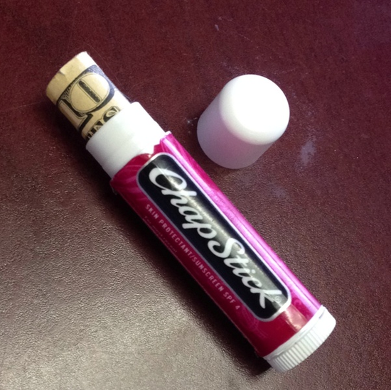 Hide money in an empty ChapStick — perfect for when you're traveling or walking in unsafe areas.