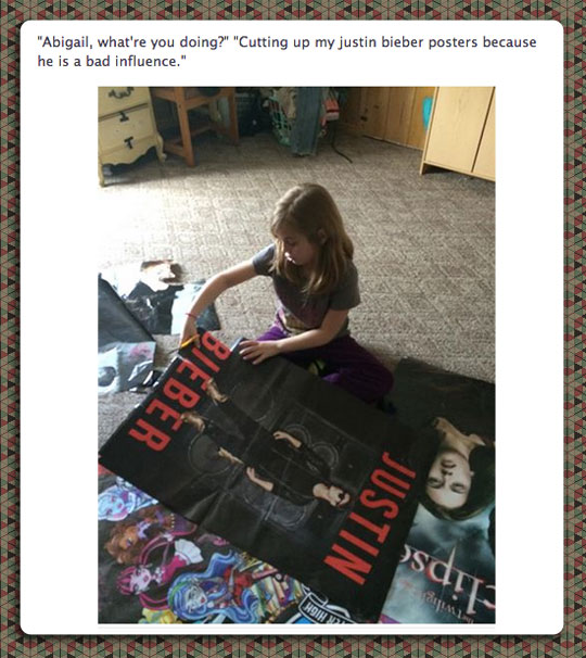 funny-girl-cutting-Justin-Bieber-posters