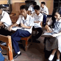funny-gif-kid-student-class-flirting-pencil