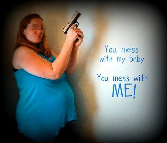 funny-awkward-pregnancy-photos-gun-mess-with-baby