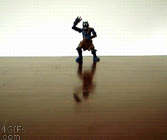 funny-gif-parrot-fighting-toy-dinosaur