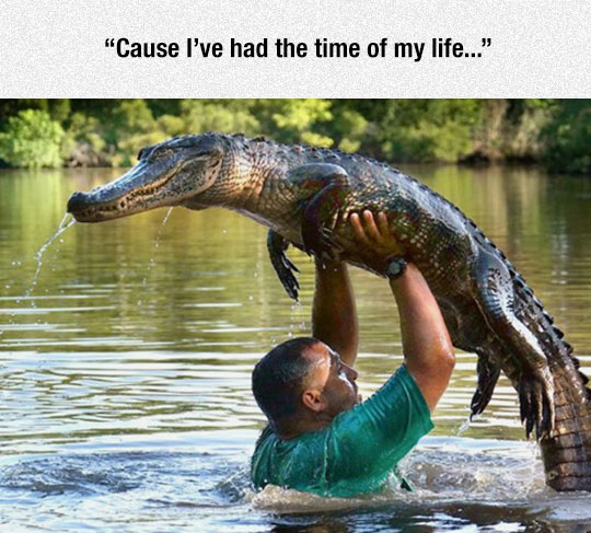 funny-man-lifting-crocodile-river