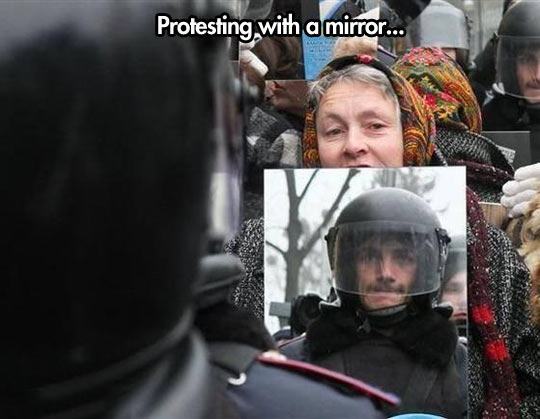 police-old-lady-protesting-mirror