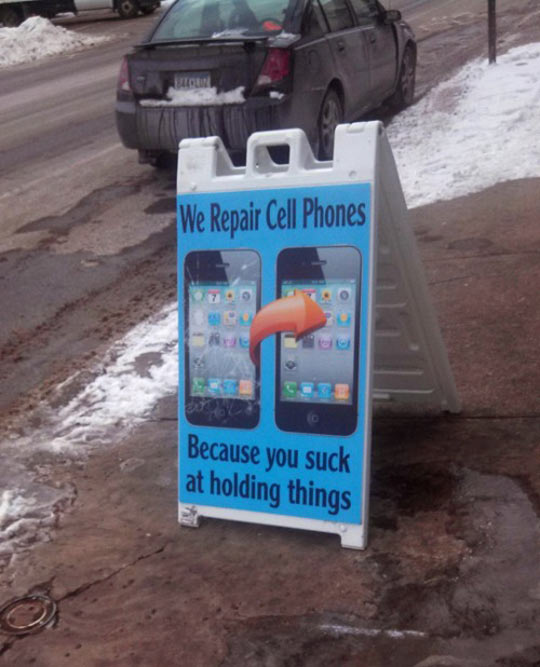 cool-sign-repair-cell-phone-holding