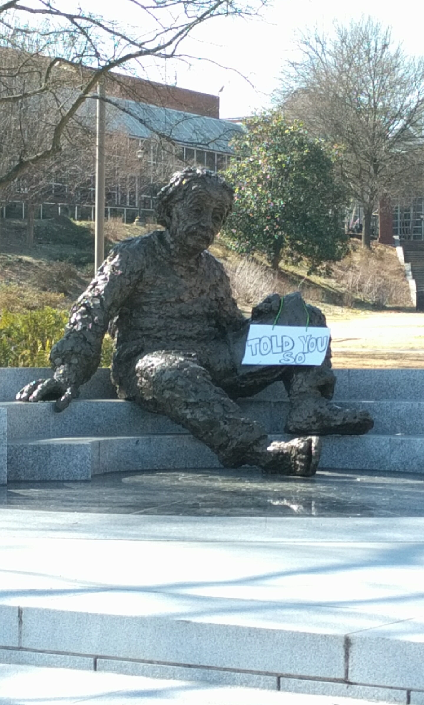 Someone put this sign on the statue of Einstein at Georgia Tech