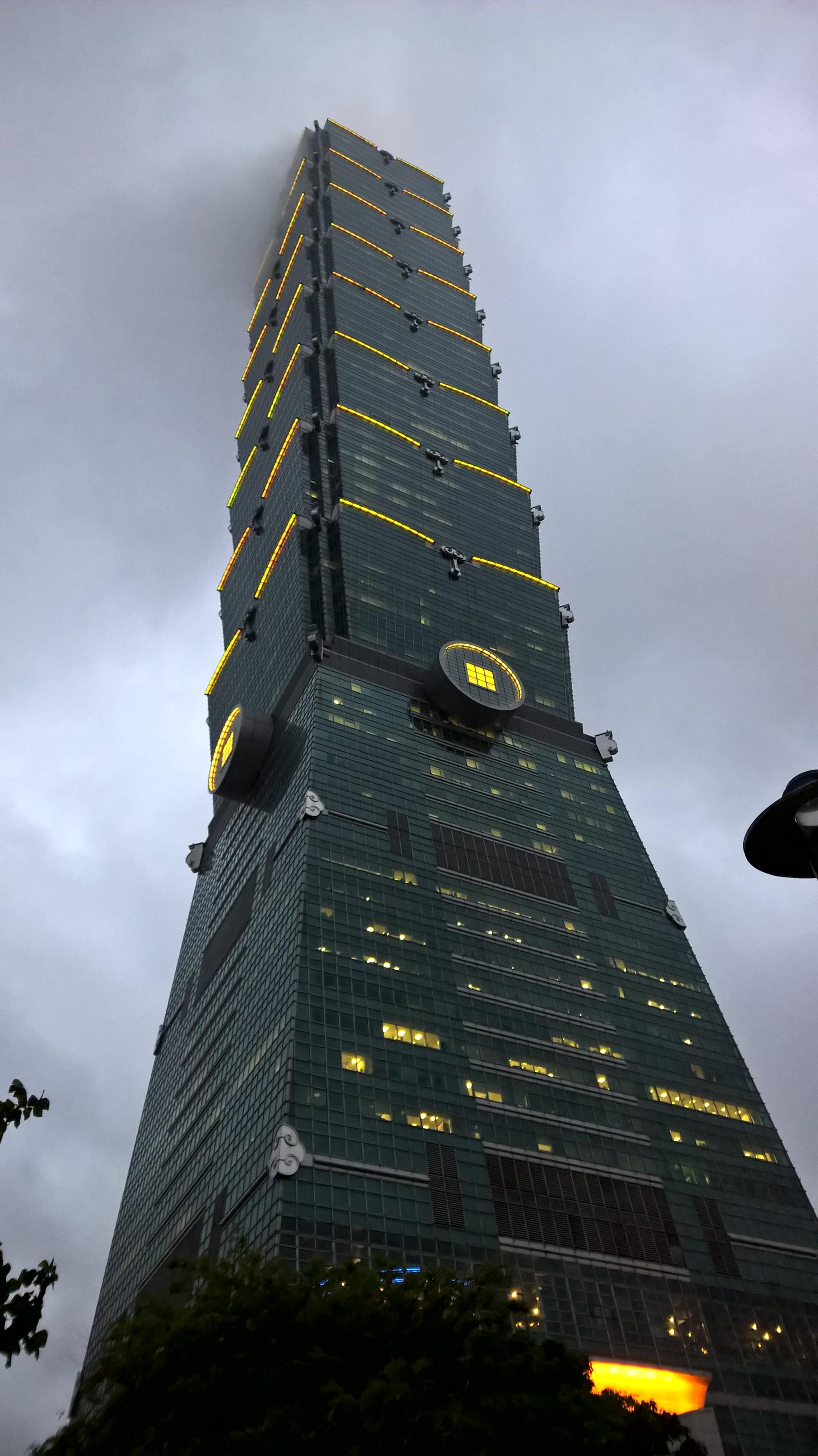 Taipei 101 in Taiwan disappearing into the clouds.