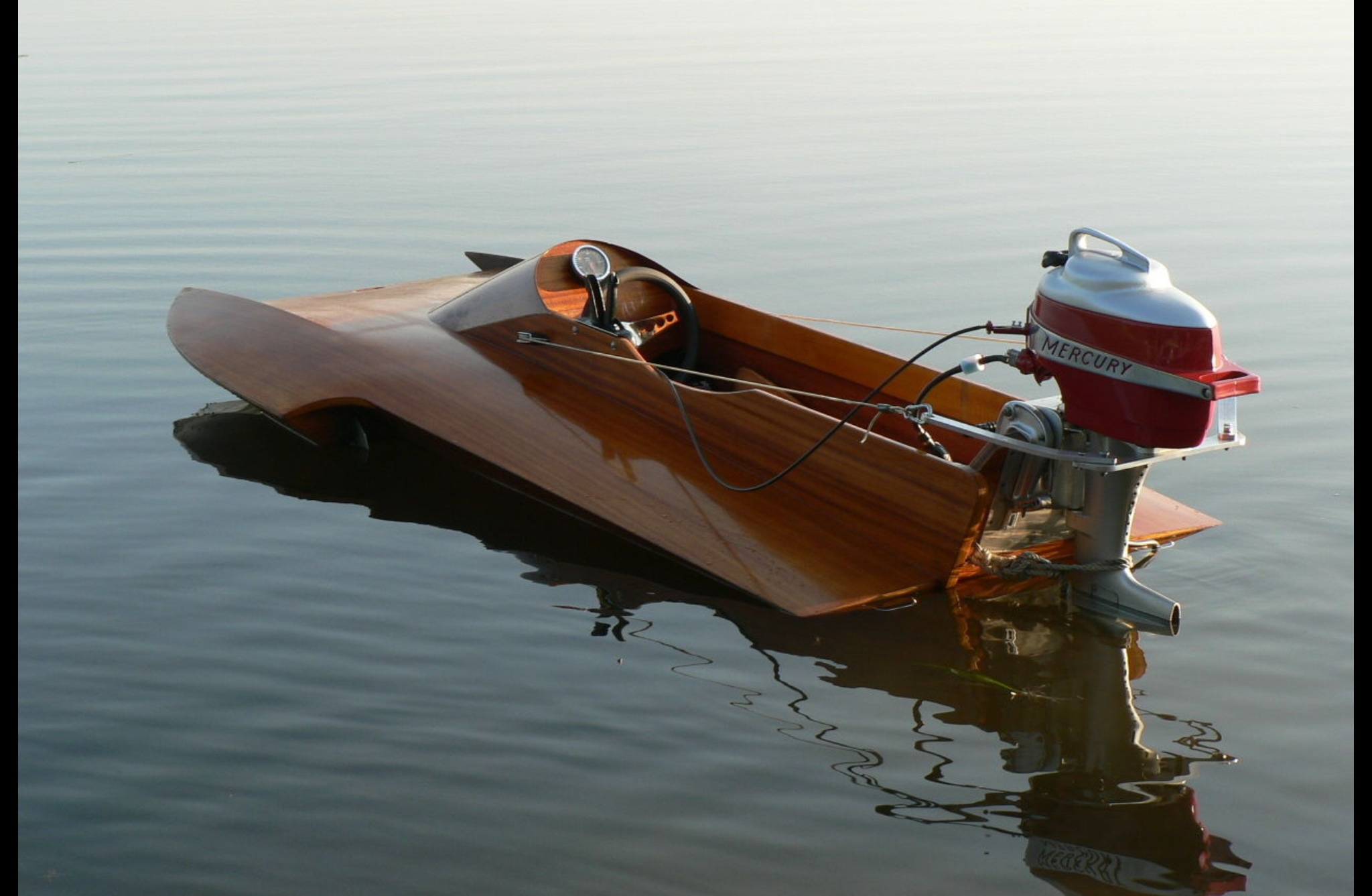 A wooden speed boat.